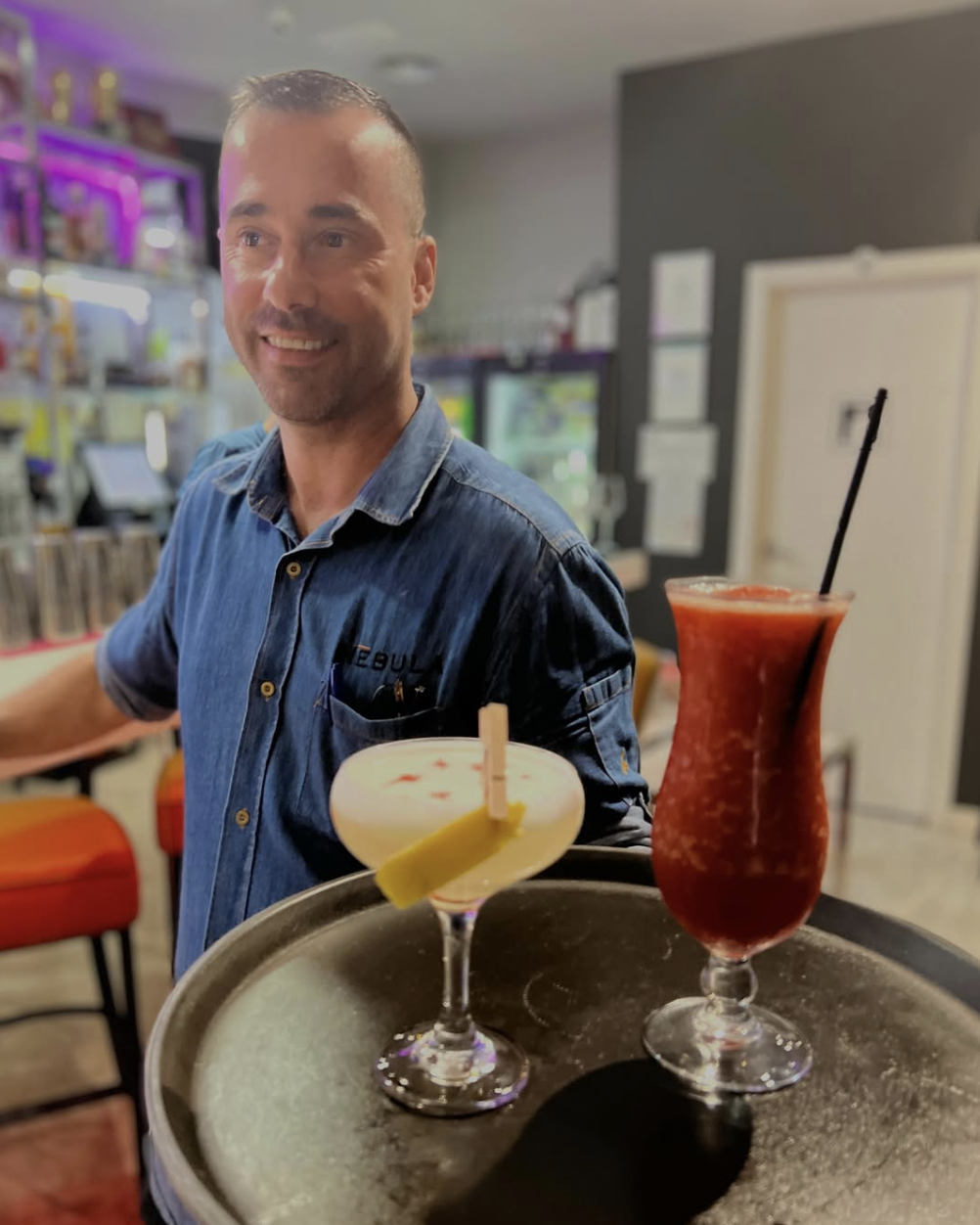 Nēbula bartender Eduardo crafting cocktails